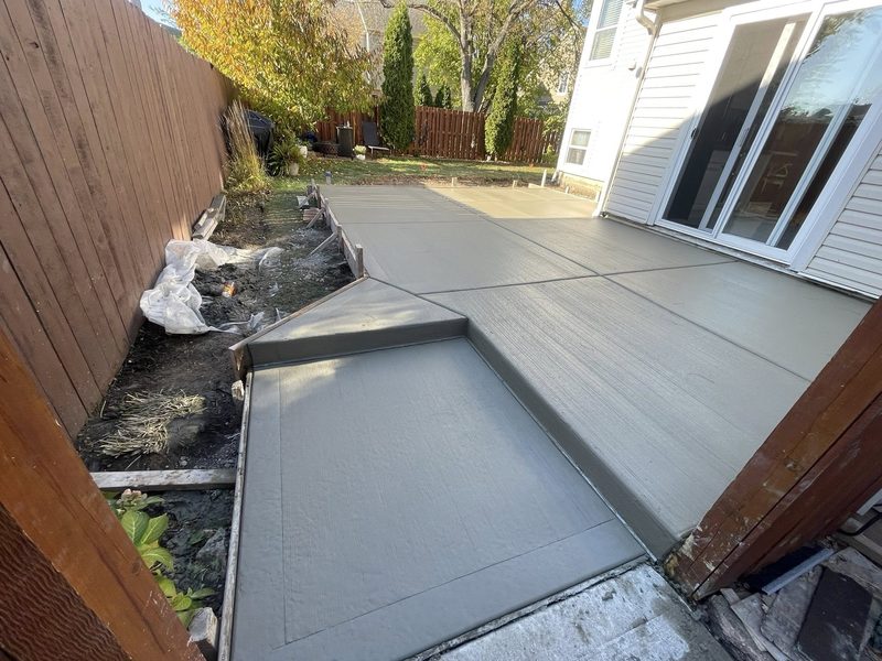 Backyard concrete patio with broom finish in Naperville