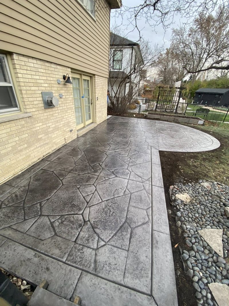 Stamped concrete patio in Naperville with Ashlar slate pattern and charcoal stain