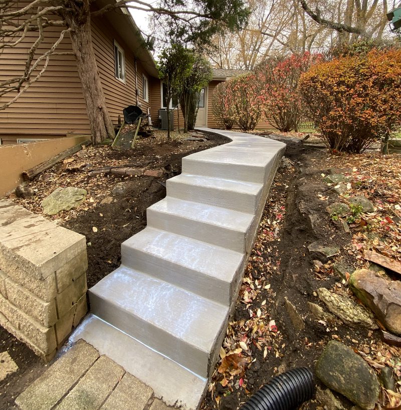 Concrete walkway from driveway to front porch